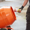 This image displays the Everbuild 209 Liquid Mortar Tone being mixed