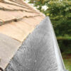 This image displays the Gutter Brush White installed into a gutter