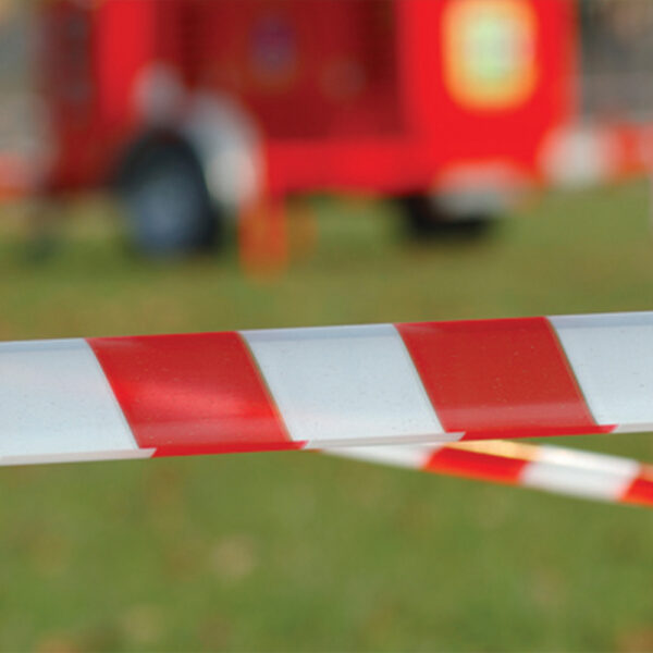 This image is the Everbuild Mammoth Barrier Tape - Red-White (72mm x 500m) In Application