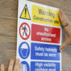 This image displays the Gorilla Heavy Duty Mounting Tape - Being applied to a back of a sign