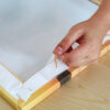 This image displays the Gorilla Heavy Duty Mounting Tape - Being applied to a frame