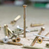 This image displays the Timco Pozi C2 Strong-Fix Twin Cut Screw Being Drilled Into A Surface
