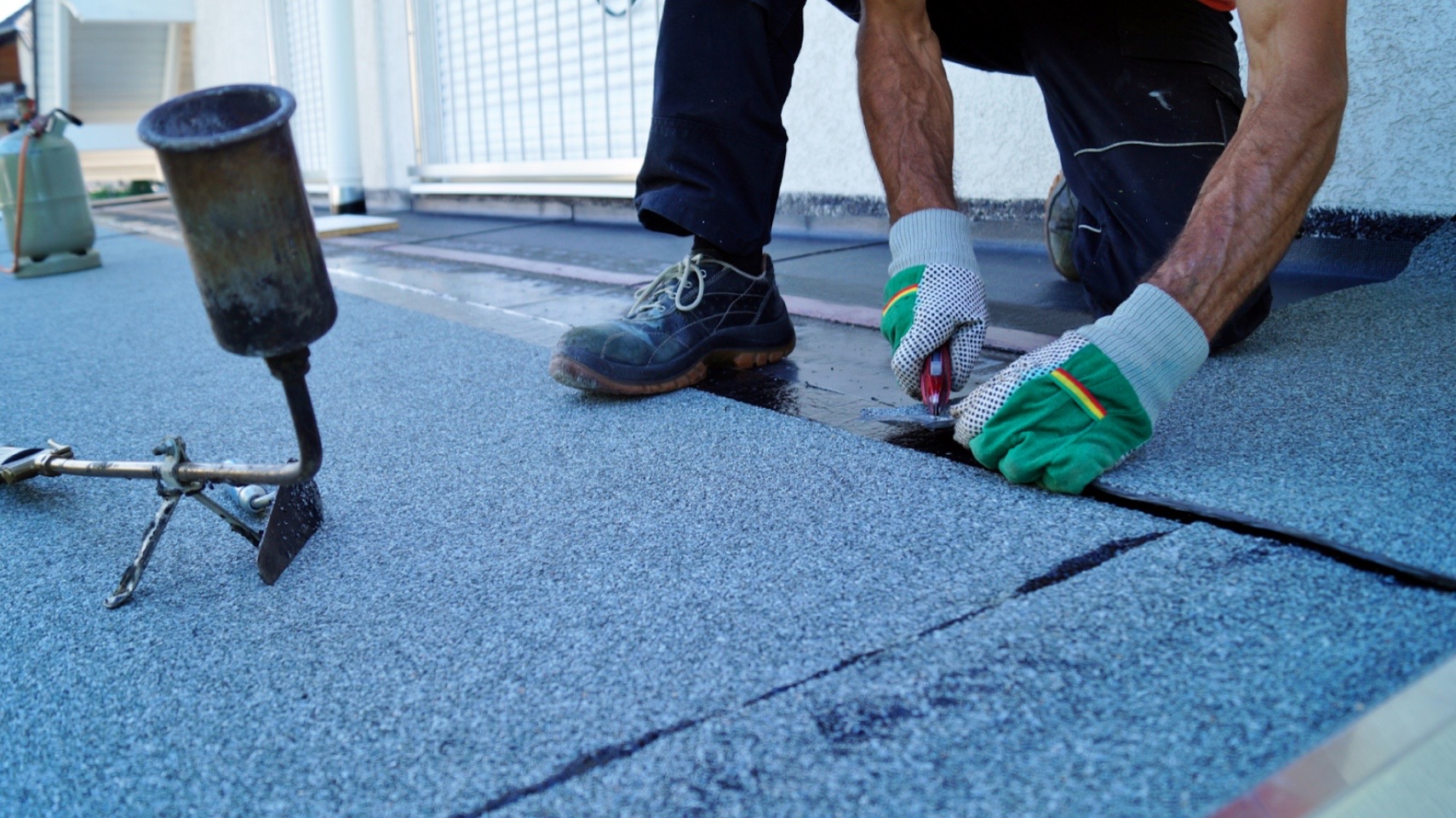 a man installing roofing felt